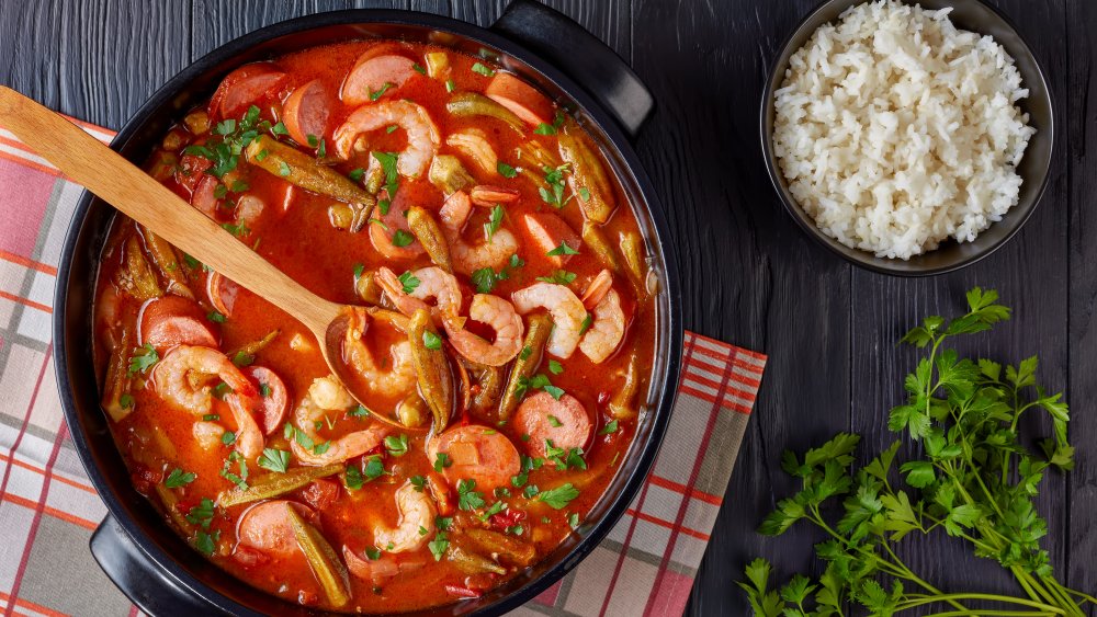 pot of gumbo with white rice on the side