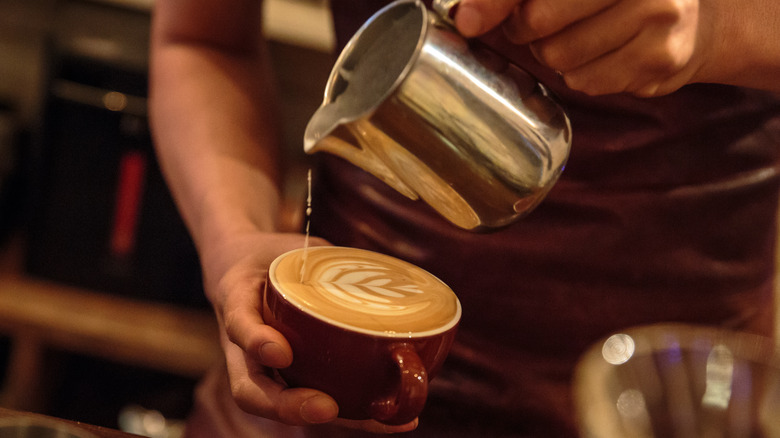 Barista making a latte