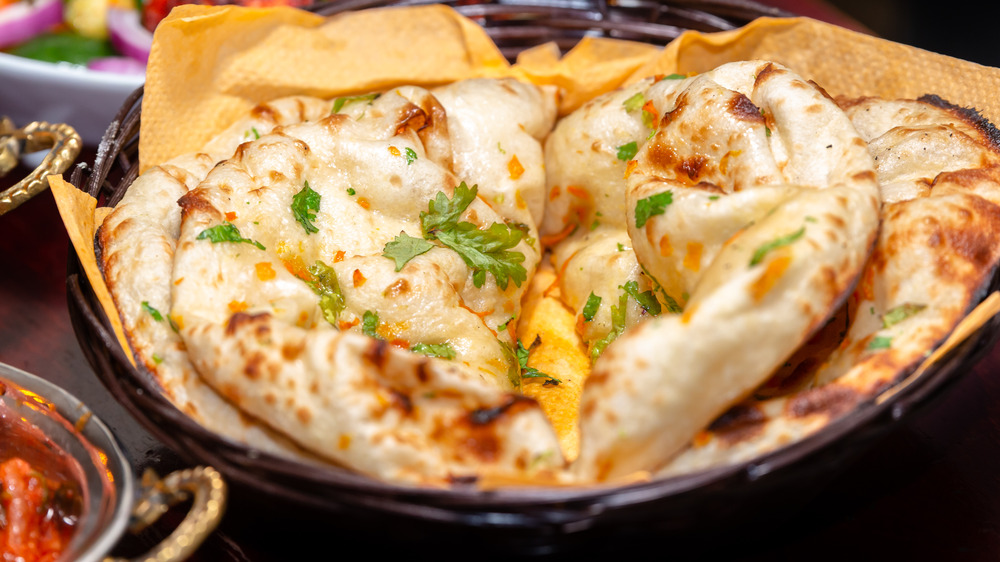 Seasoned naan in a basket