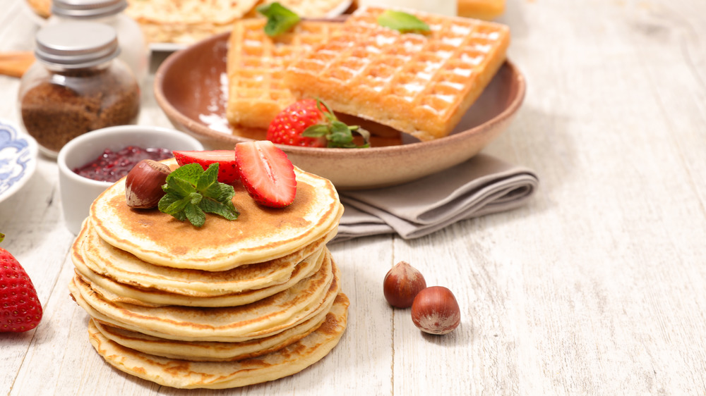 Fruit-topped pancakes and sugary waffles