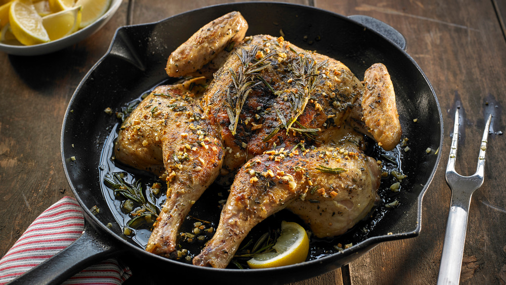 Spatchcocked chicken in a cast-iron pan