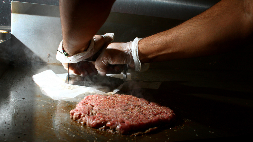 Burger cooking on the grill