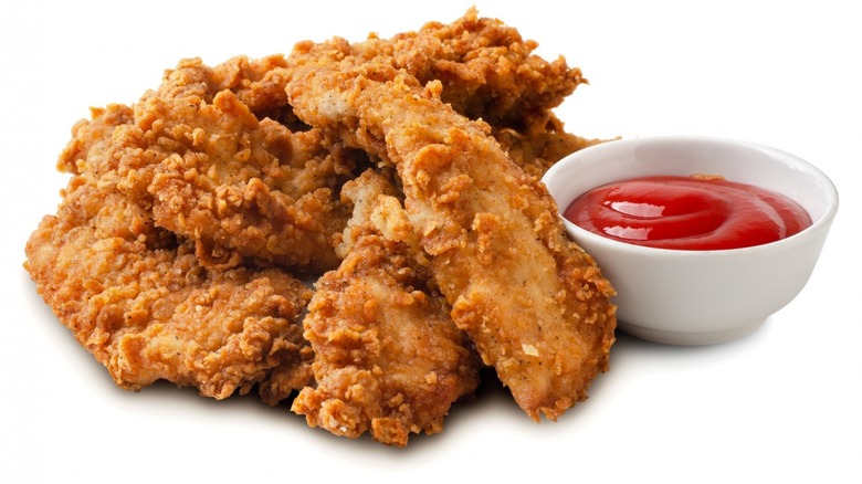 Chicken tenders with side of ketchup