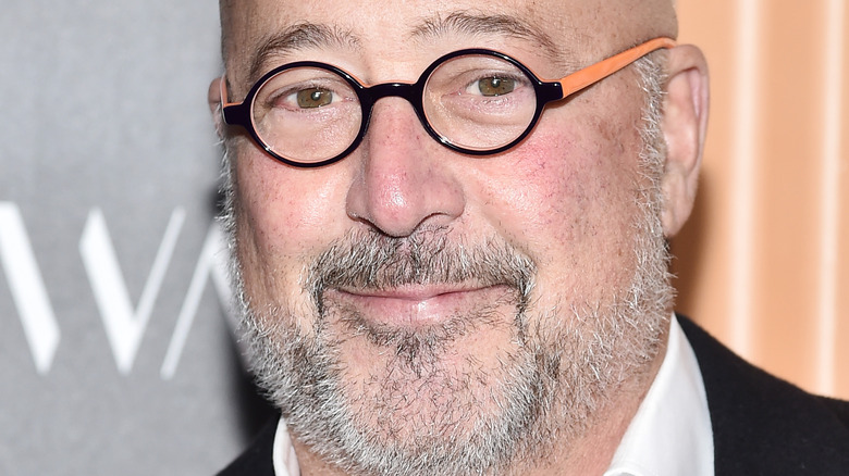 Andrew Zimmern wearing glasses