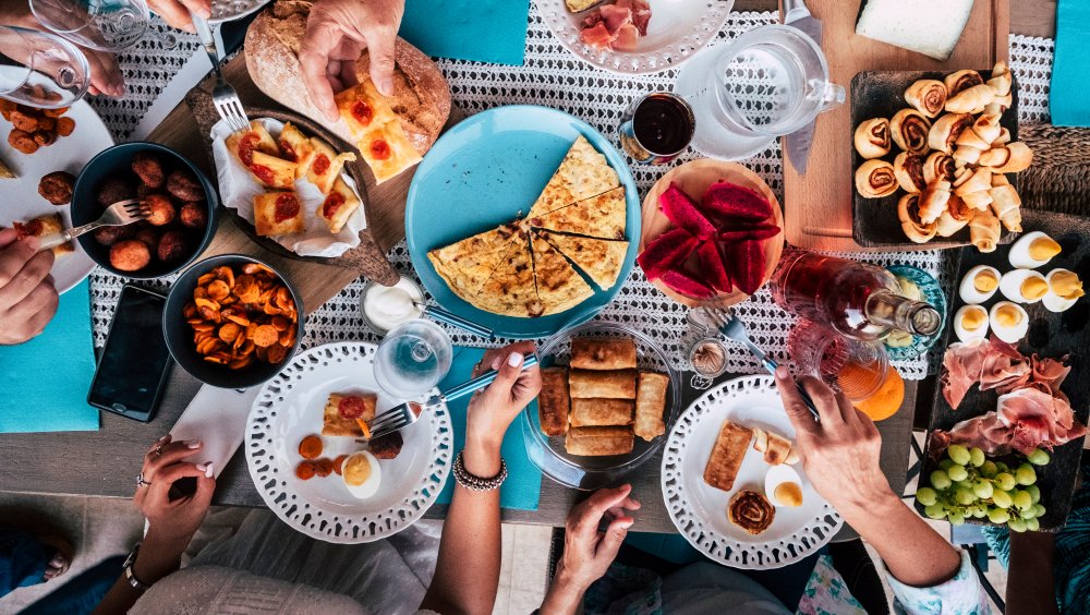 Brunch spread with eggs, potatoes, pastries and frittatas