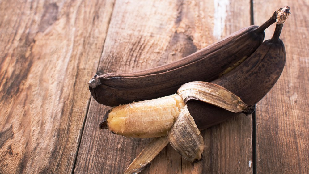 overripe bananas against a wood background