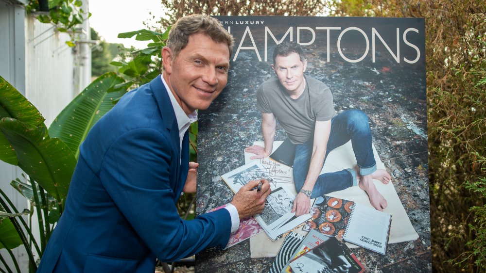Bobby Flay signs a poster