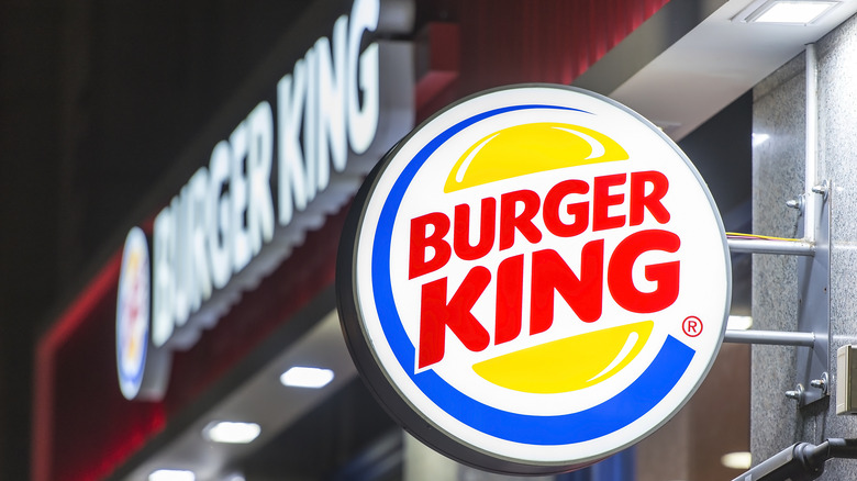 Burger King sign against a blue sky background