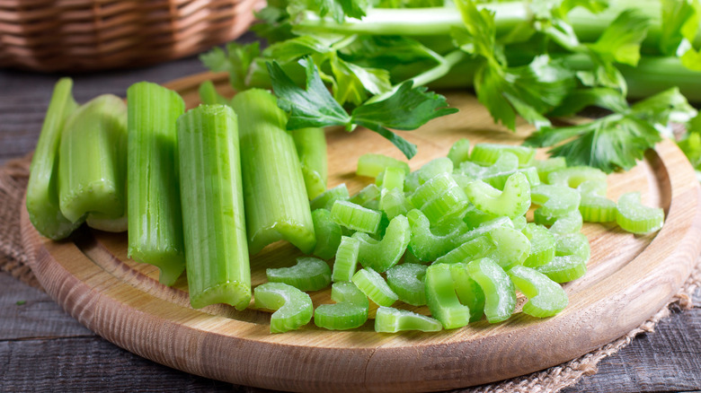 Sliced celery on cutting board