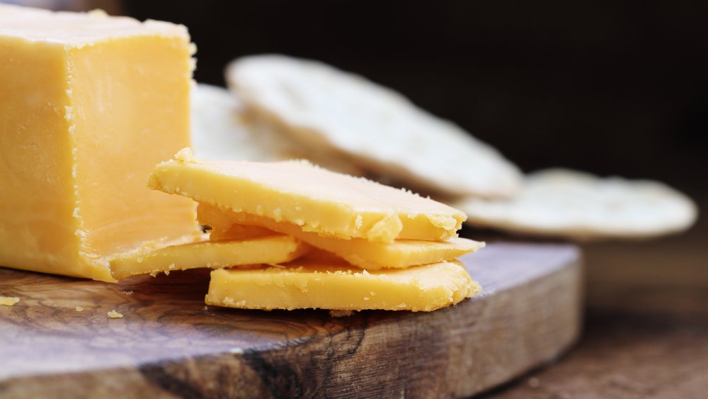 Cheddar on a wooden chopping board