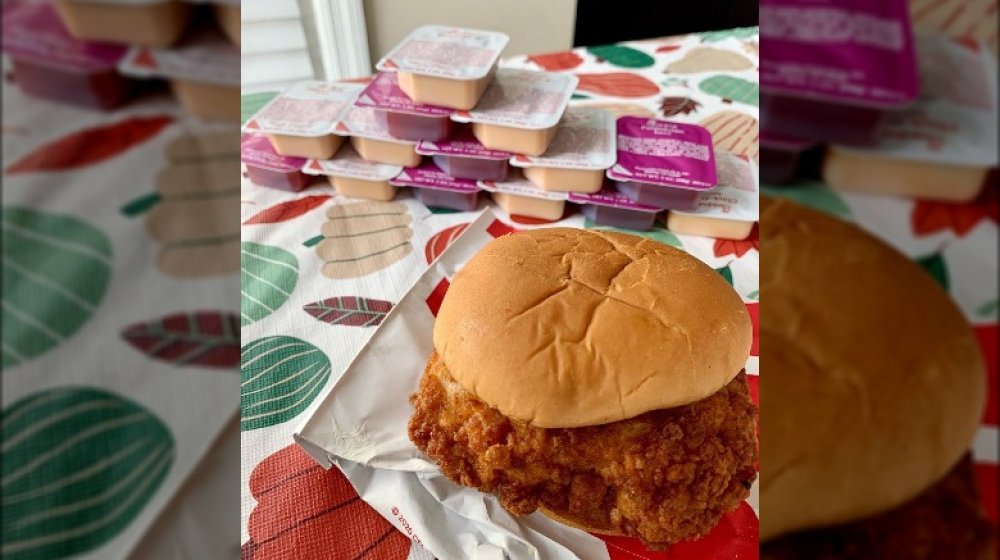 Chick-fil-A sandwich with packets of sauce