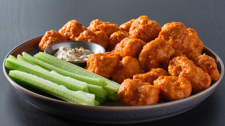 Plate of chicken wings and celery