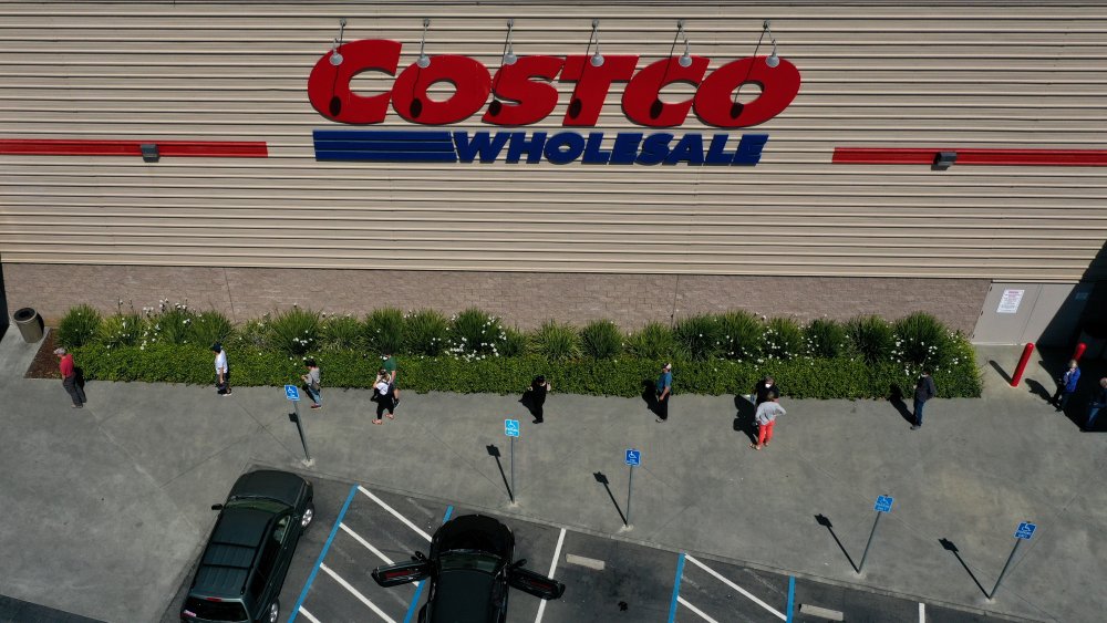 Costco customers wait in line social distanced