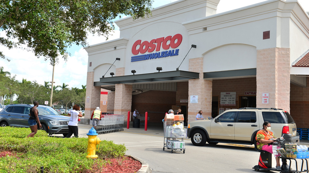 People with full carts leaving Costco