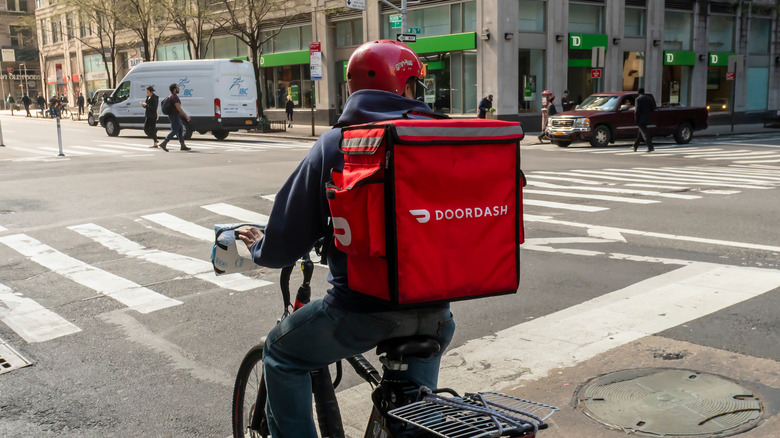 DoorDash delivery person on a bike