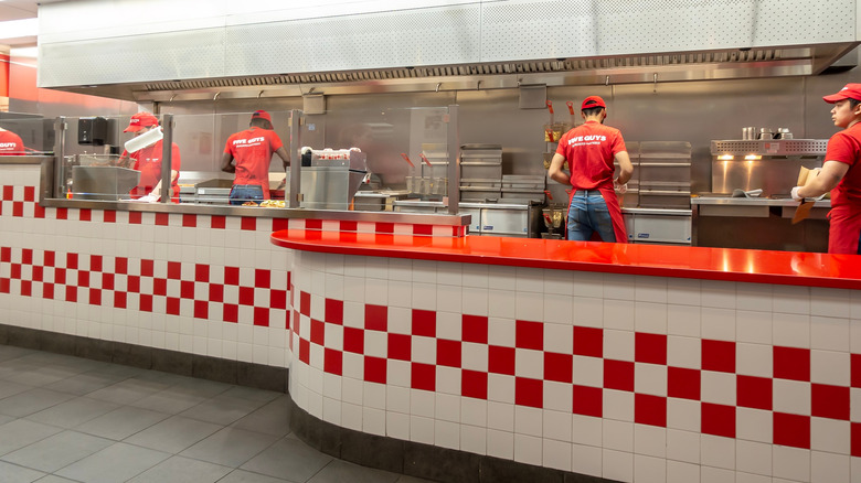 Five Guys workers in kitchen