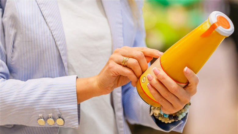 Woman reading food label