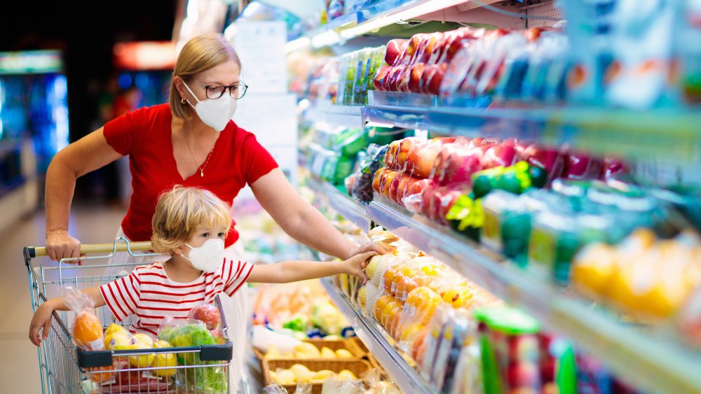 Masked shoppers buying groceries during the pandemic