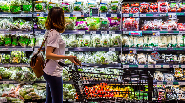 Person looking at produce section of grocery store