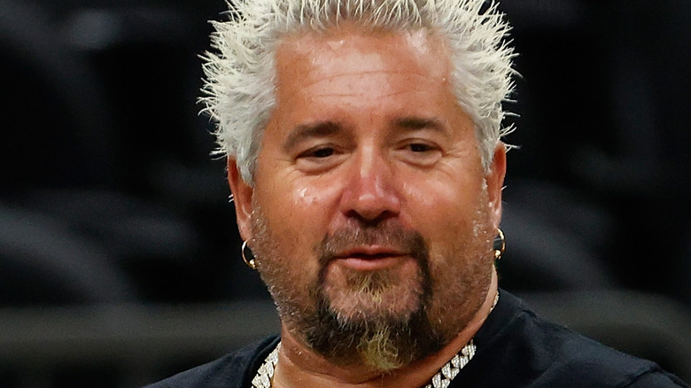 Guy Fieri wearing sparkly necklace