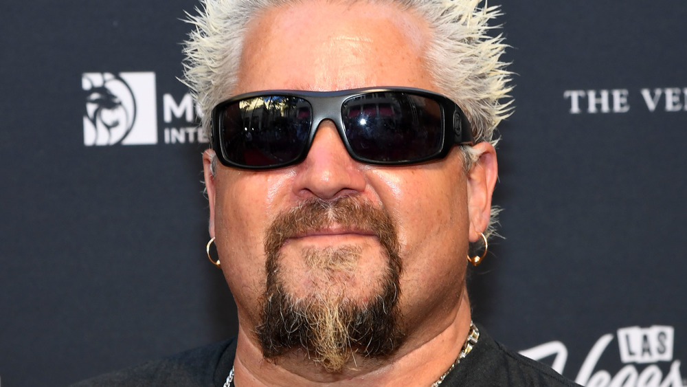 Guy Fieri with dark sunglasses on