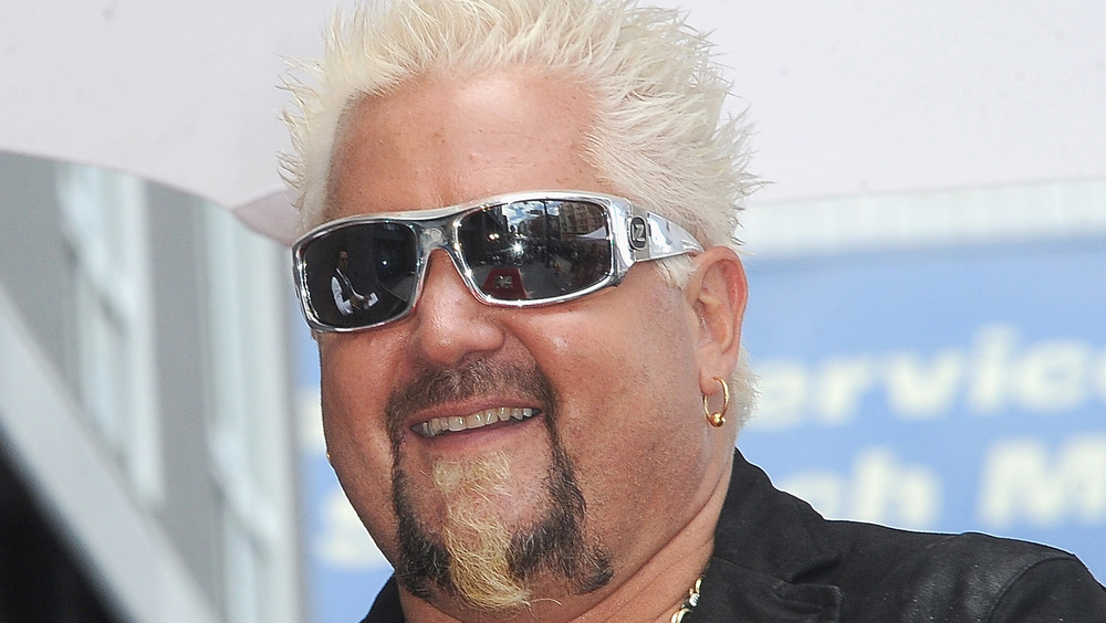 Guy Fieri in silver sunglasses