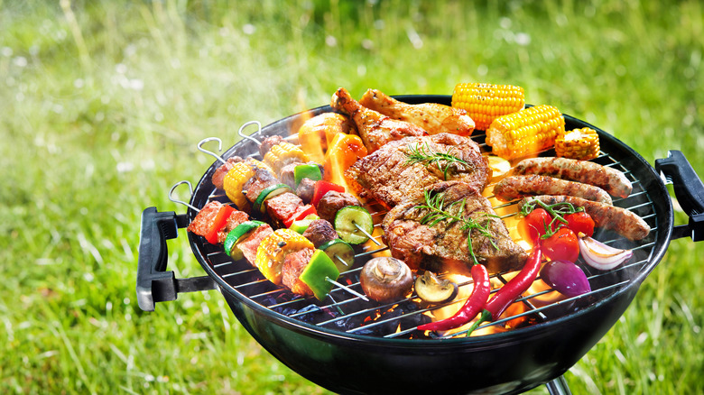 Grill with chicken and vegetables on top