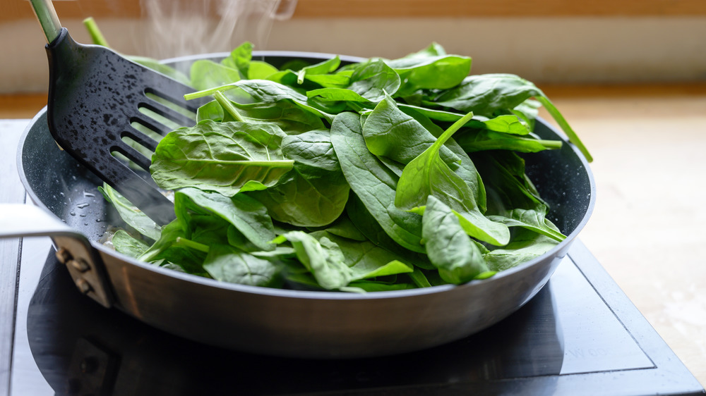 Spinach cooking on stove