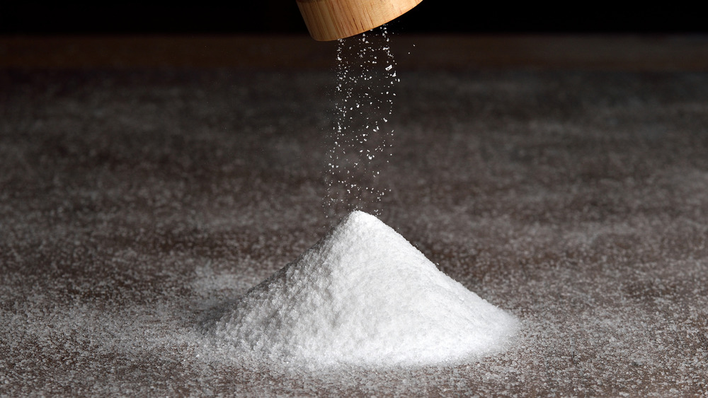 Salt being added from a grinder