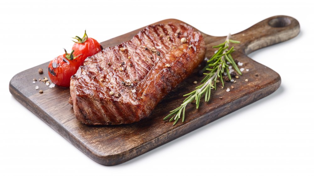 Grilled steak on a wooden board