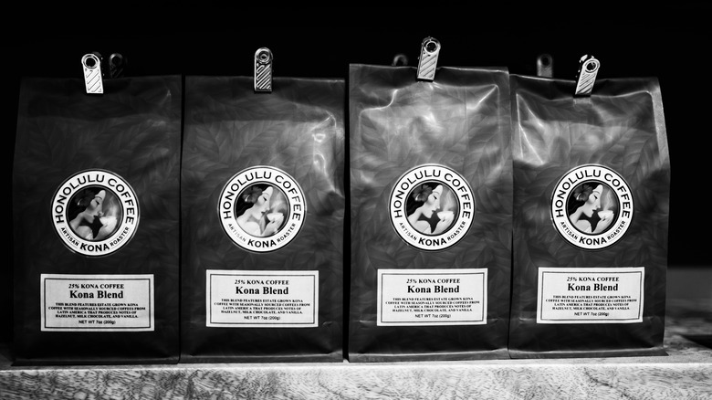 Black and white photo of bags of Kona coffee