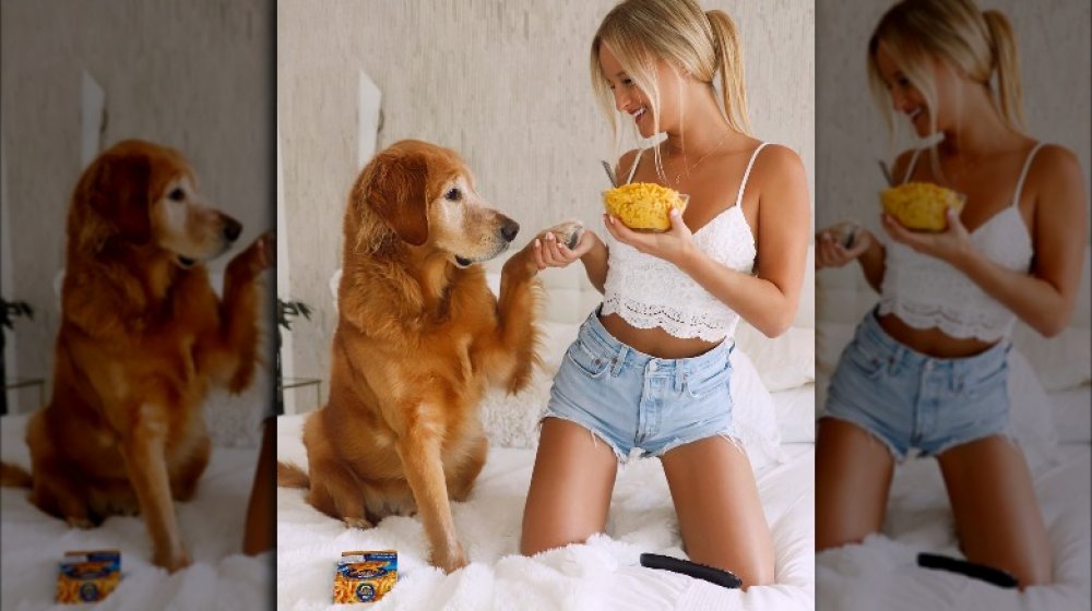 Woman and dog with Kraft macaroni and cheese