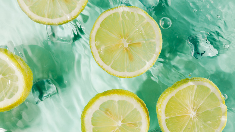 Slices of lemons floating in water