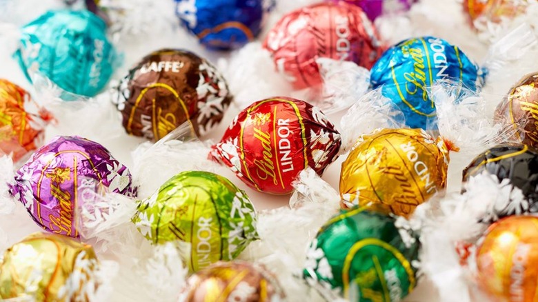 Multi-colored Lindt chocolates in wrappers