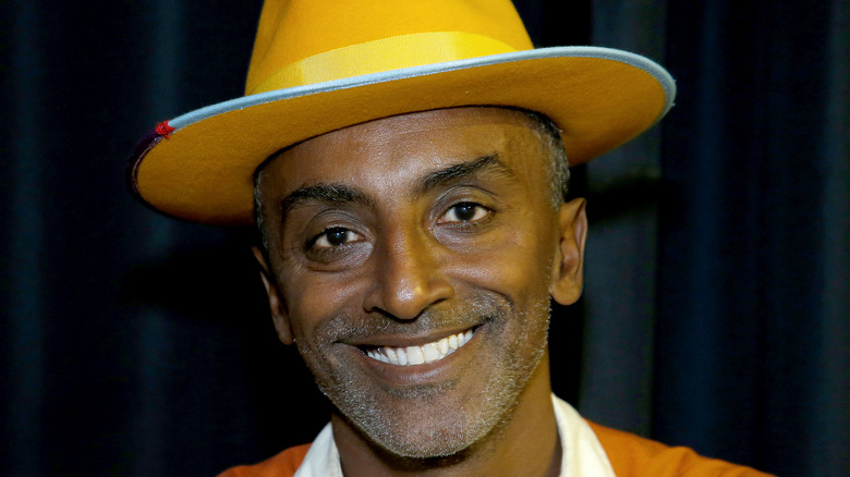 Marcus Samuelsson wearing yellow hat