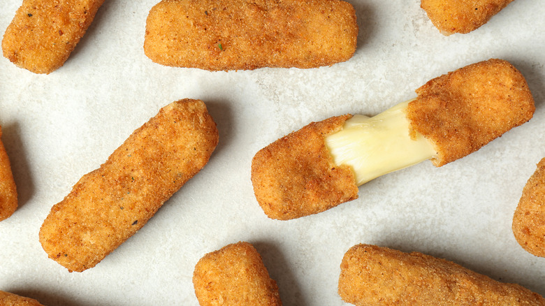 Mozzarella sticks on a grey background