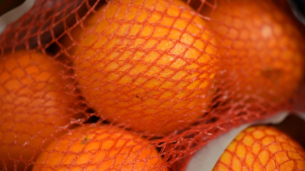 oranges in red bag