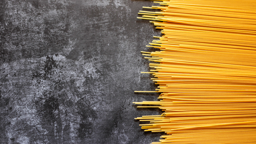 Yellow pasta on a black background