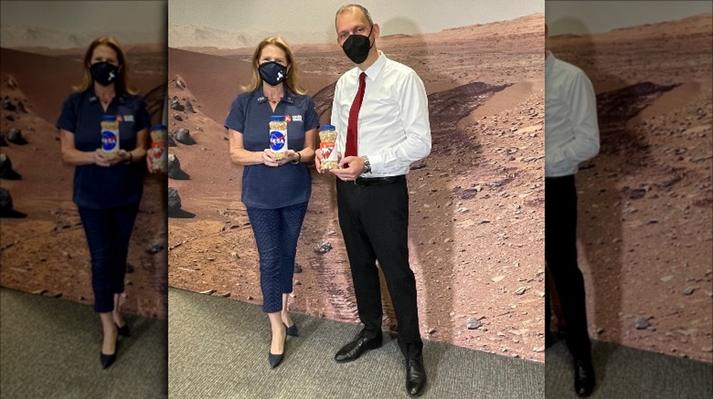 NASA officials pose with peanuts