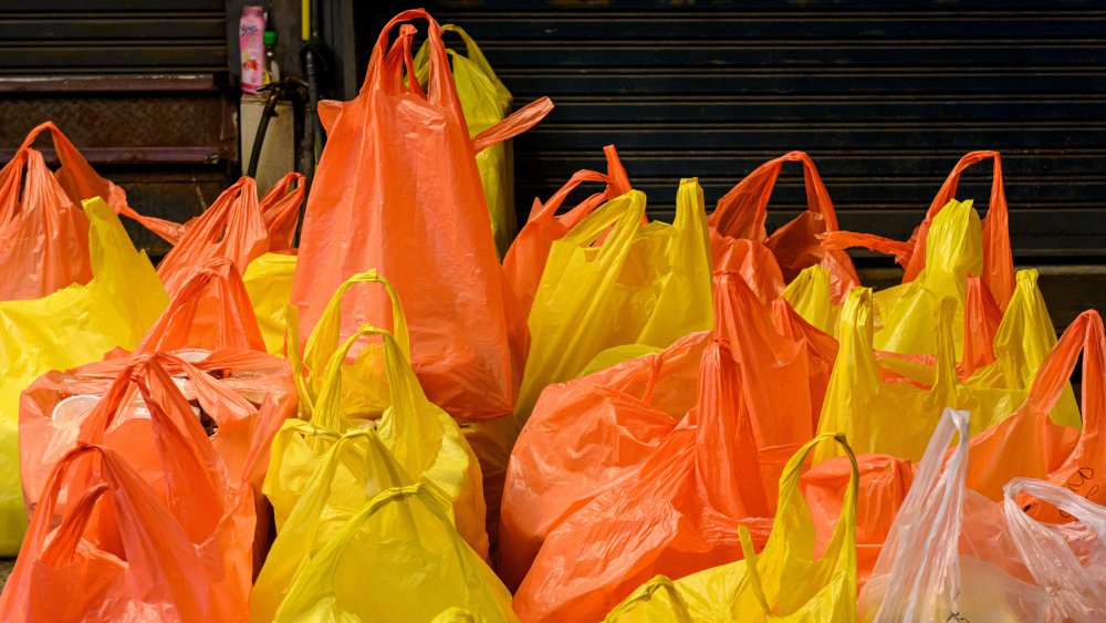 Orange and yellow plastic shopping bags