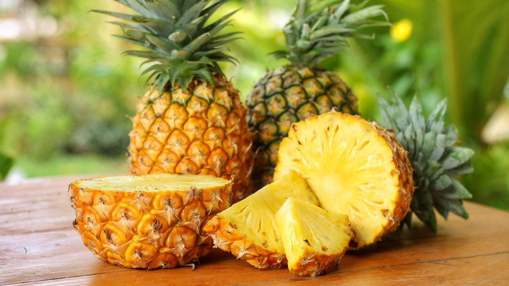 Several pineapples on a table