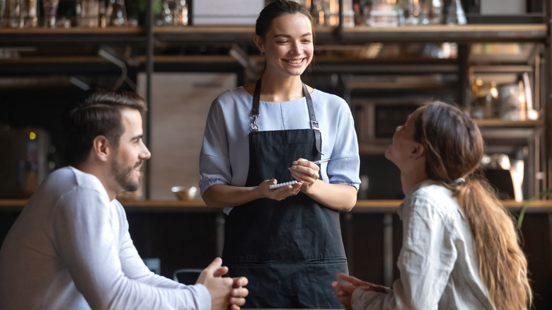 Waitress taking order at restaurant