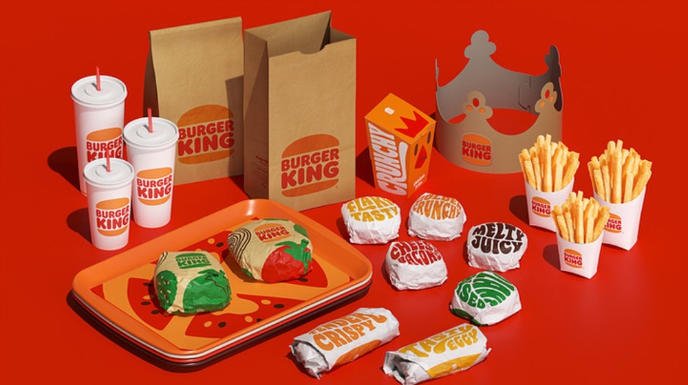 Assorted Burger King products with new branding on red background