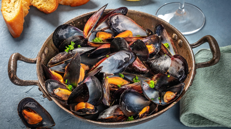 Fresh mussels in pan