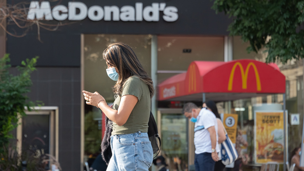 People walking past McDonalds