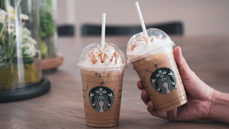 Two Starbucks cold drinks on tabletop