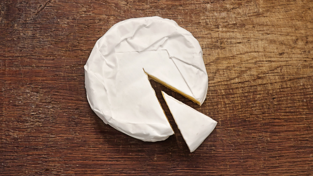 Brie cheese with a slice cut out