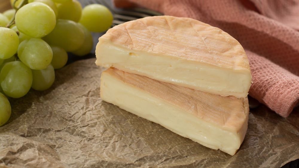 French Munster cheese sliced in half