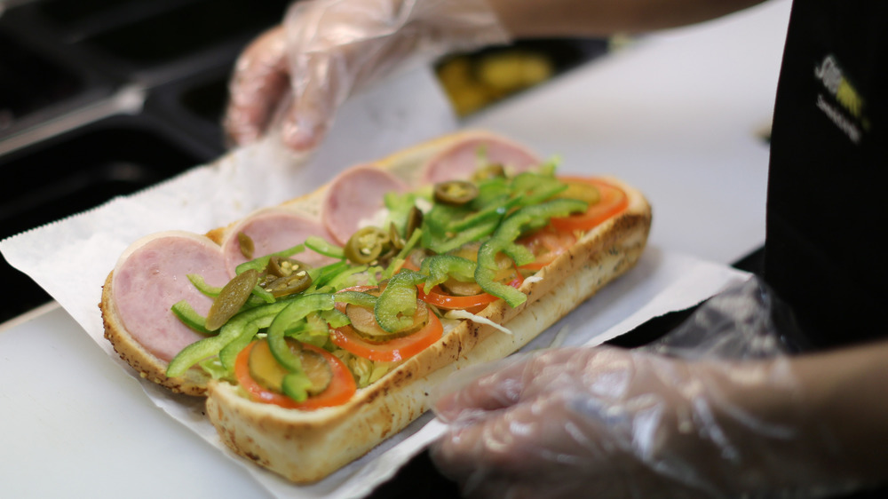 Subway employee making a sandwich