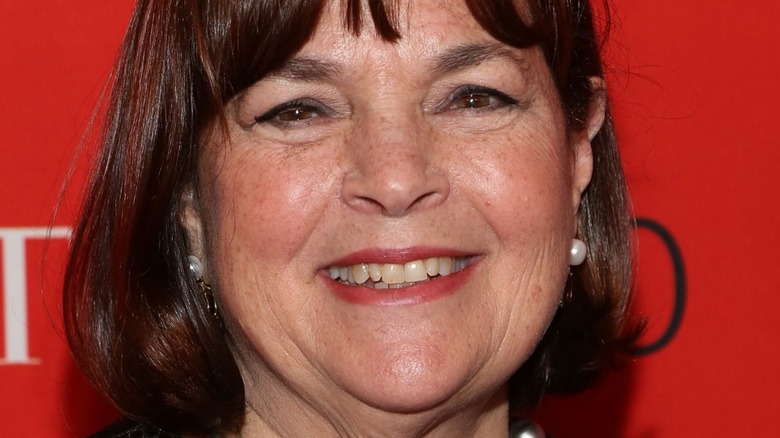 Ina Garten with wide smile and pearl earrings